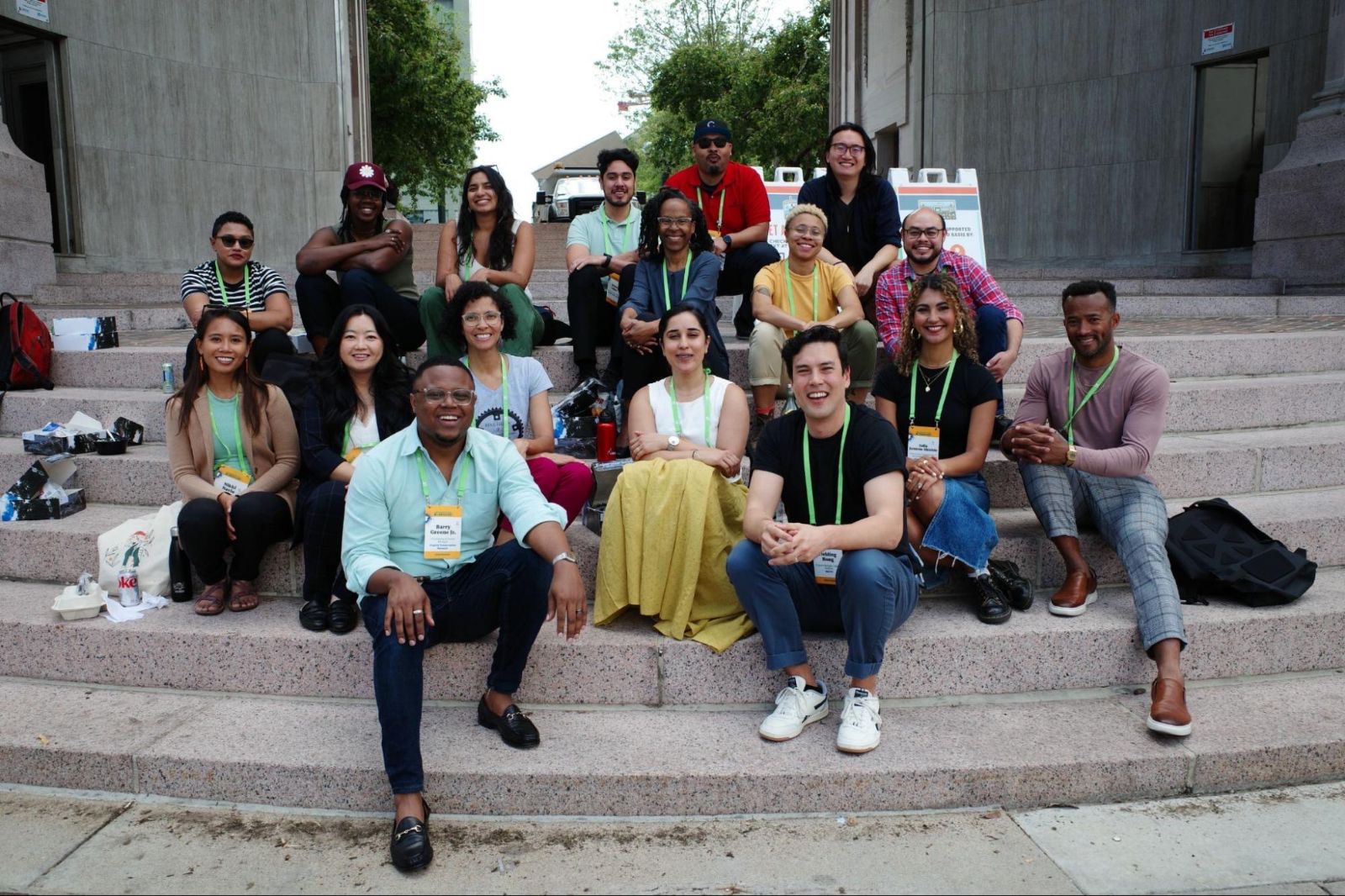 Transportation Justice Fellowship cohort seated together on stone steps