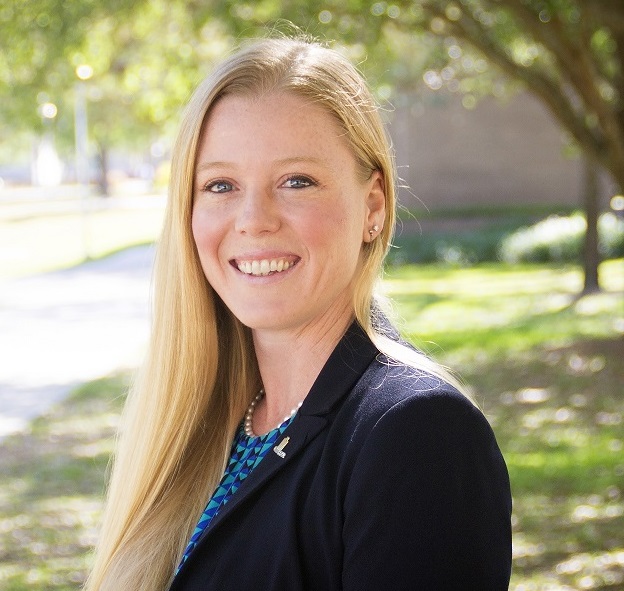 A professional headshot of Jodi Godfrey